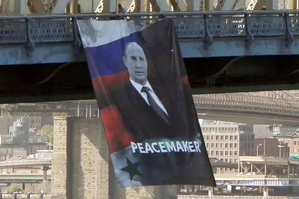 Dictator or Peacemaker? A Vladimir Putin banner hanging off the Manhattan Bridge in early October.