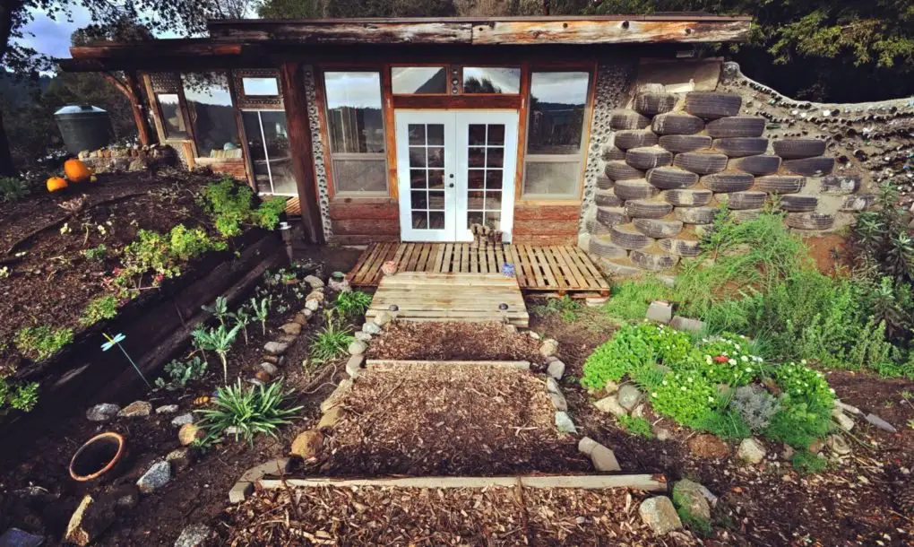 How This Couple Built an ‘Earthship’ Tiny Home For Less Than $10K 10K-Earthship-Tiny-Home-1