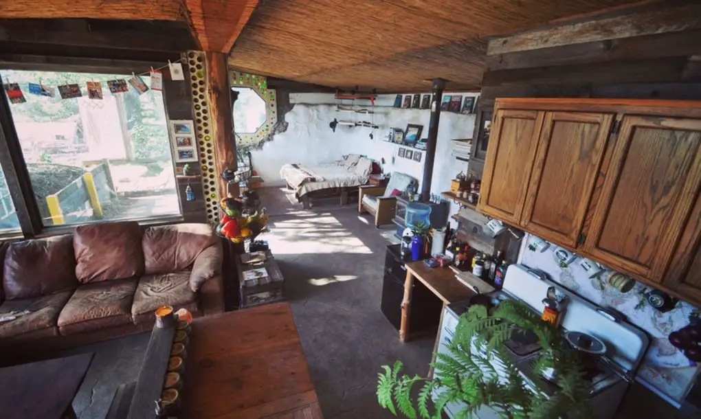 How This Couple Built an ‘Earthship’ Tiny Home For Less Than $10K 10K-Earthship-Tiny-Home-11